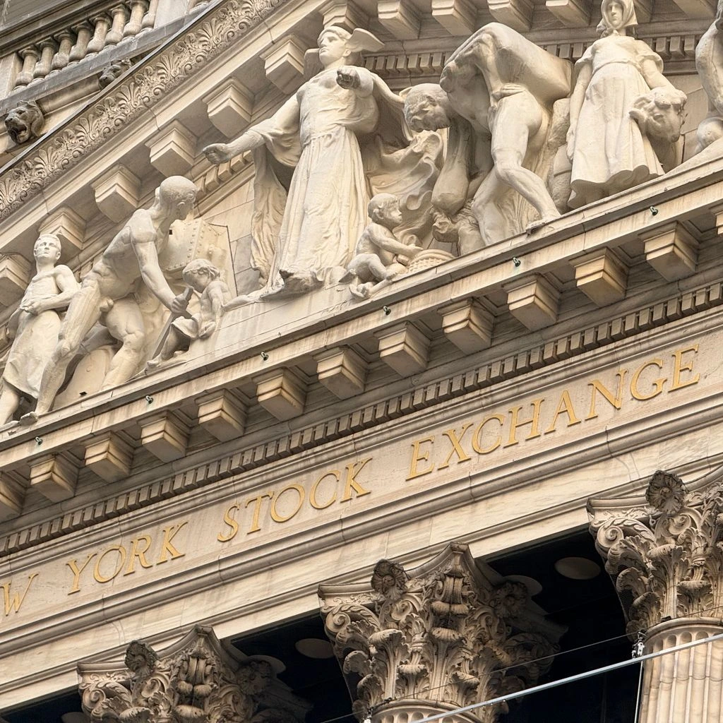 Wall Street trading floor at the opening bell on a busy morning.